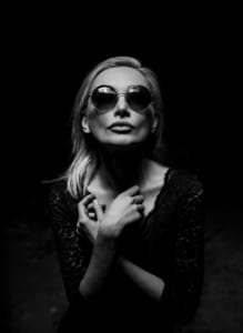 black & white image of a lady with sunglasses